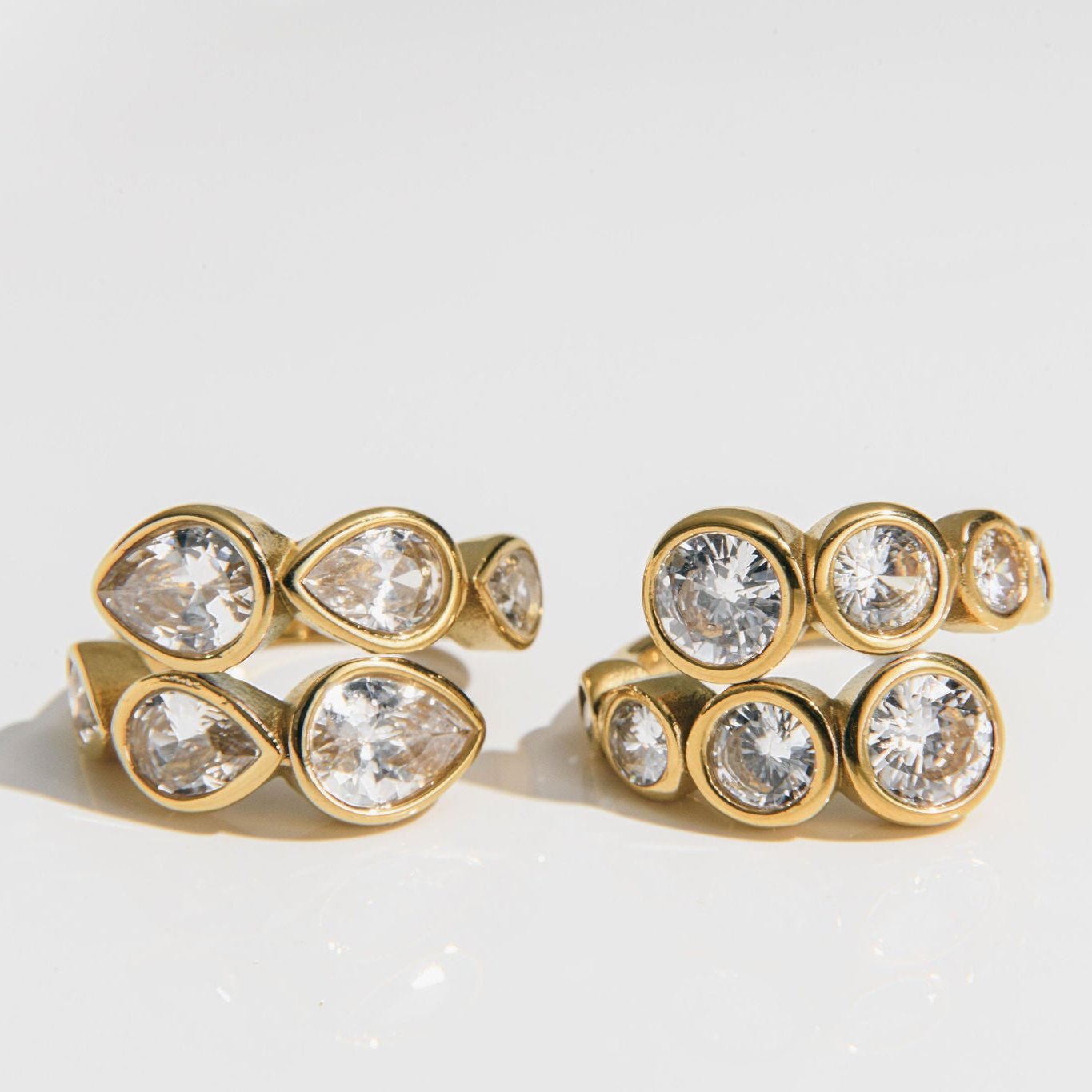 chunky gold statement ring with wraparound bezel-set cubic zirconia stones