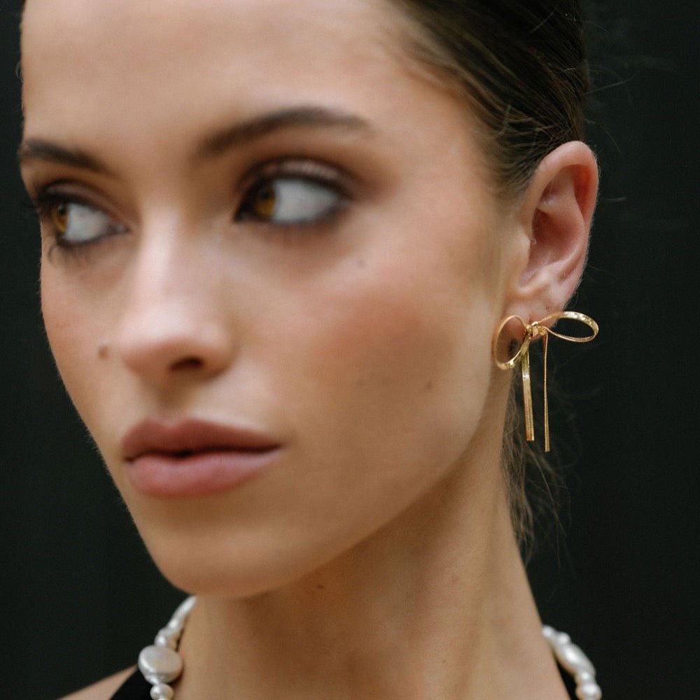 statement gold short drop bow earrings