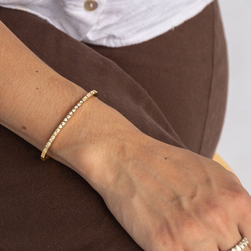 gold-plated bangle with cubic zirconia and etched criss-cross detail