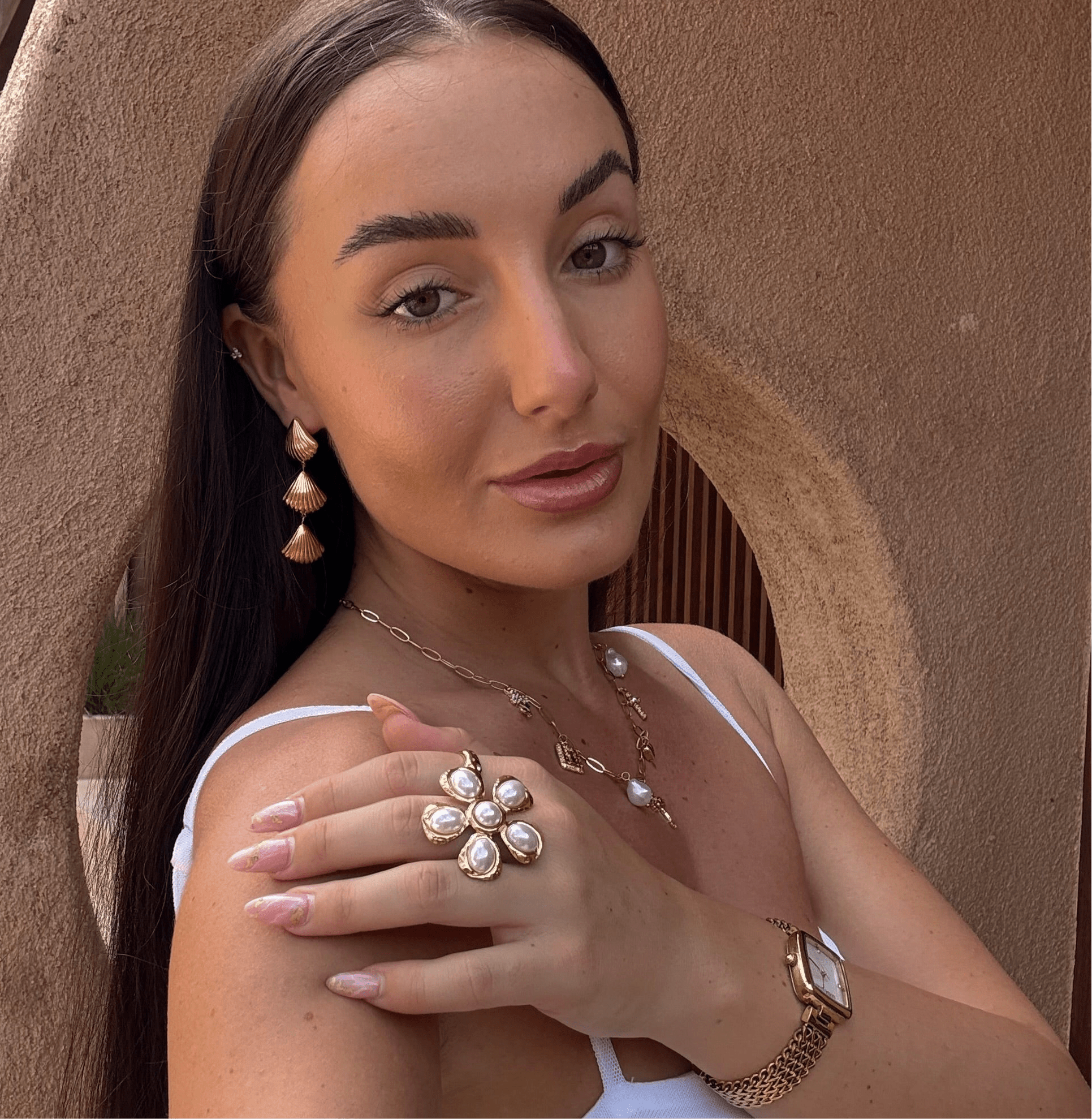 Gold floral statement ring with six freshwater pearls in a hammered setting