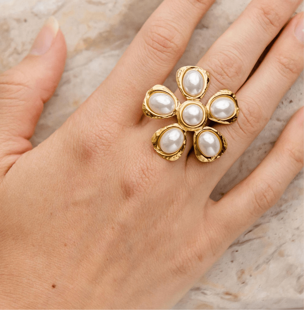 Gold floral statement ring with six freshwater pearls in a hammered setting