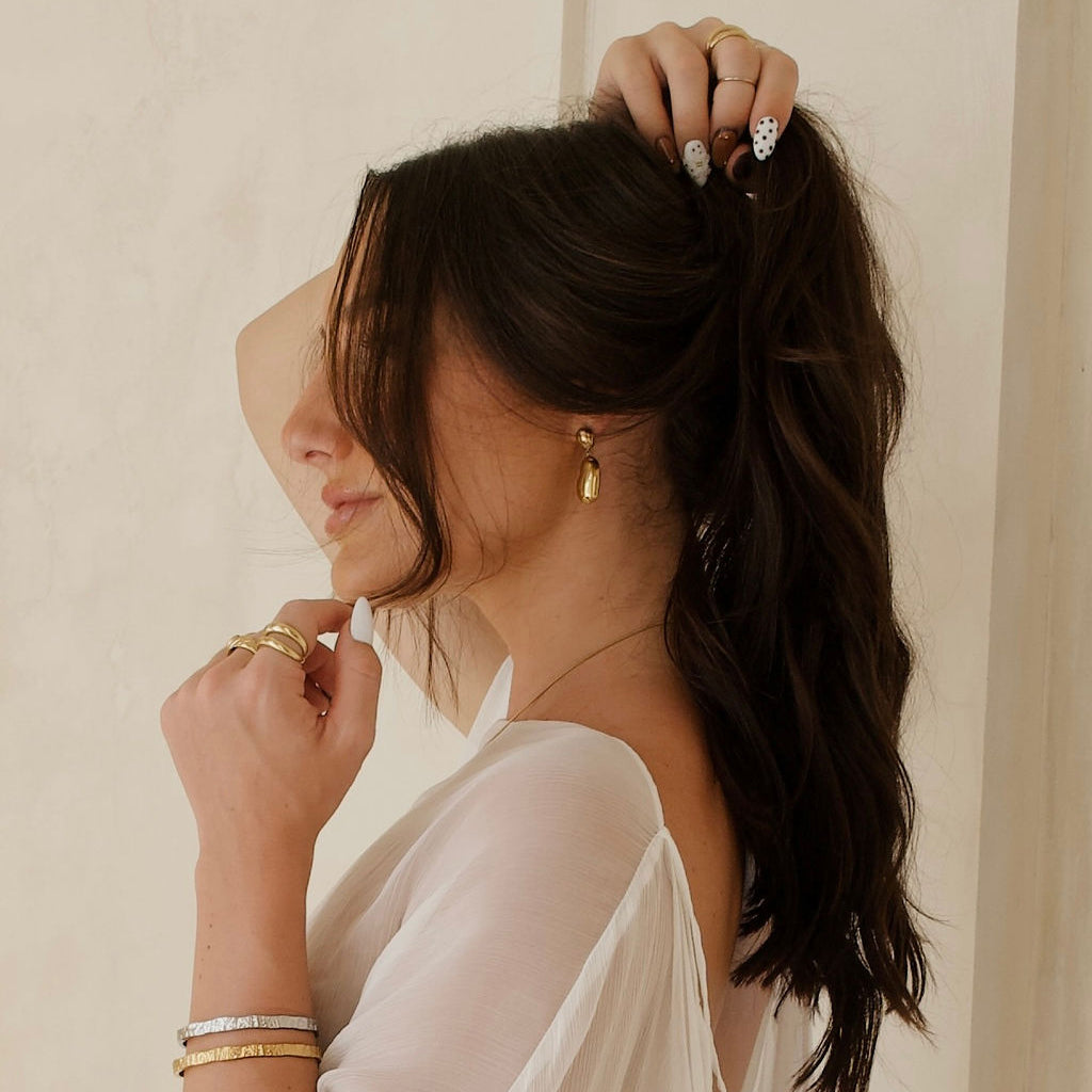 Capri gold stud earrings with polished organic-shaped drops