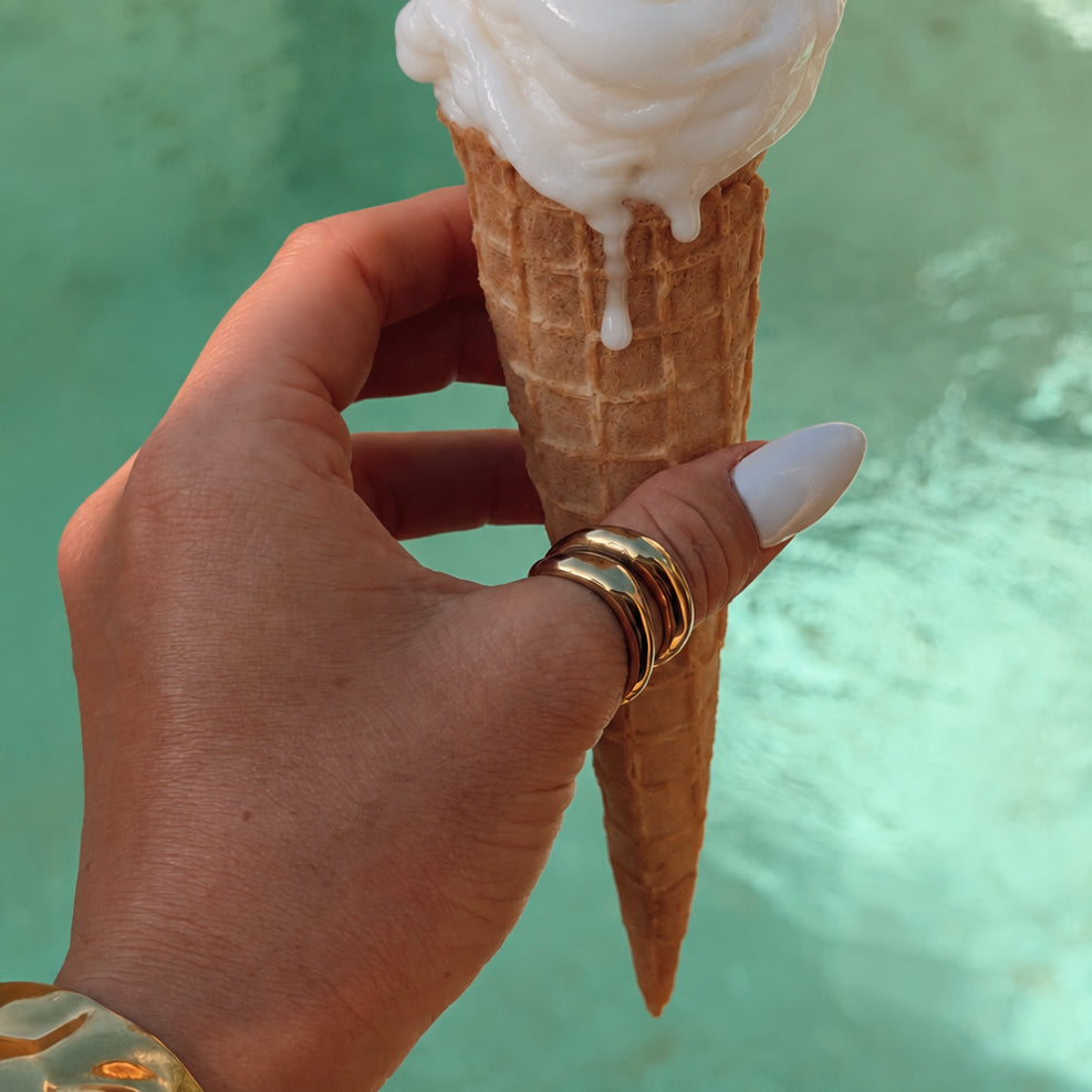 Cove sculptural gold statement ring with an open-front double-band design