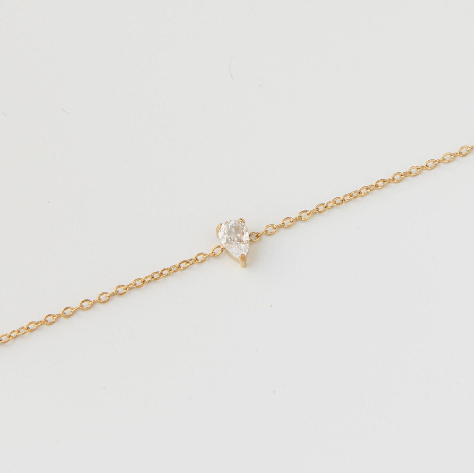 dainty gold bracelet with teardrop cubic zirconia on fine chain