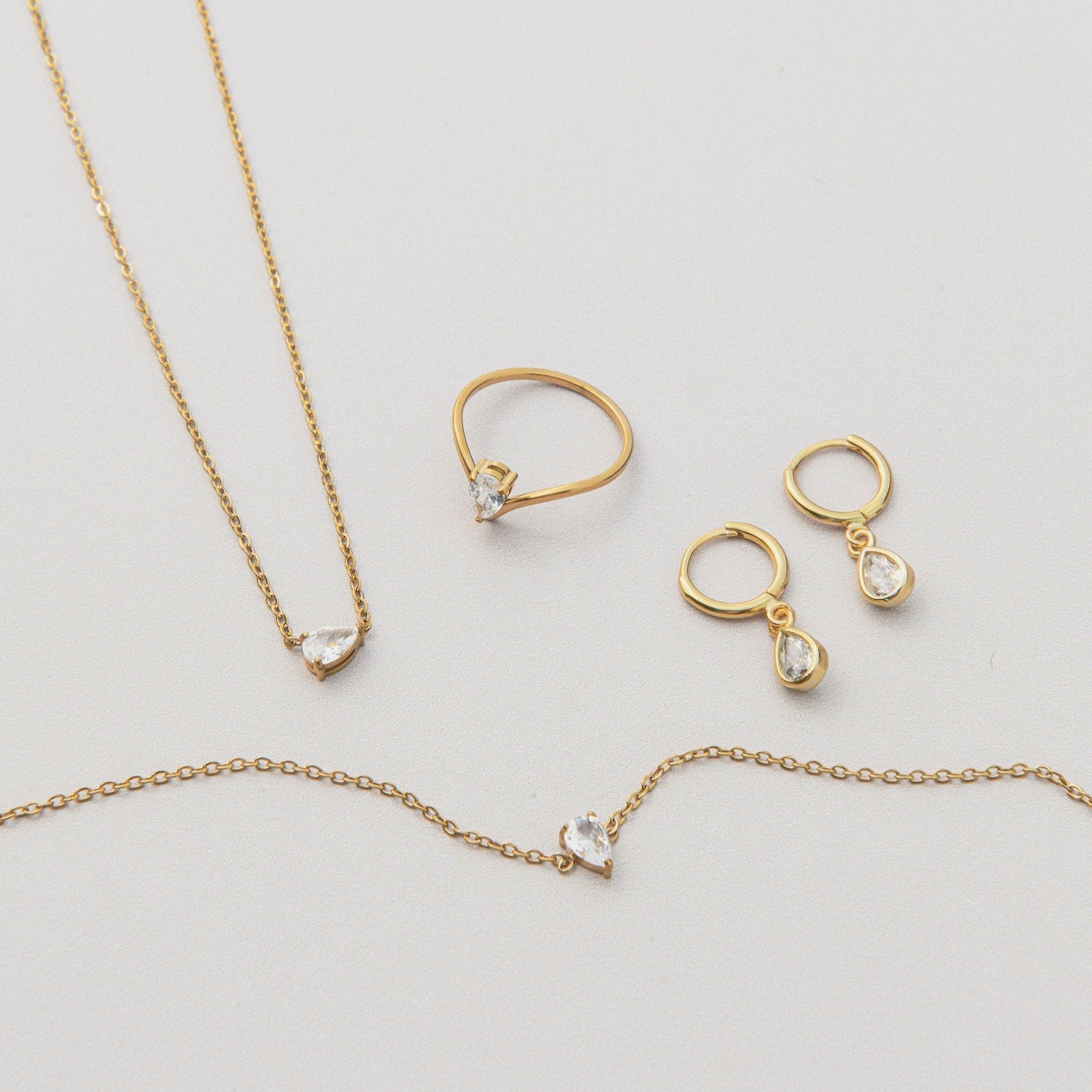 dainty gold bracelet with teardrop cubic zirconia on fine chain