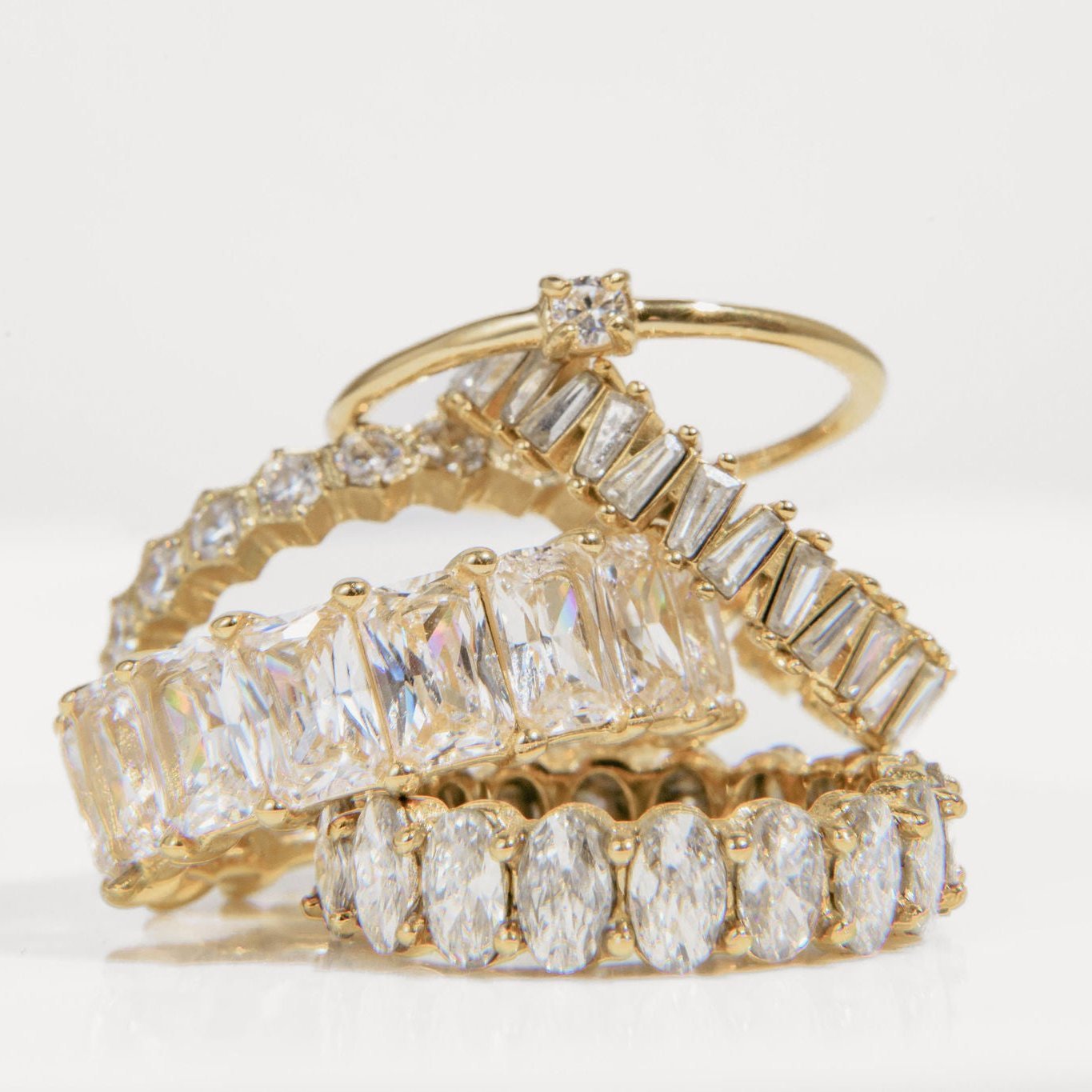 gold ring with single round Cubic Zirconia on a fine band