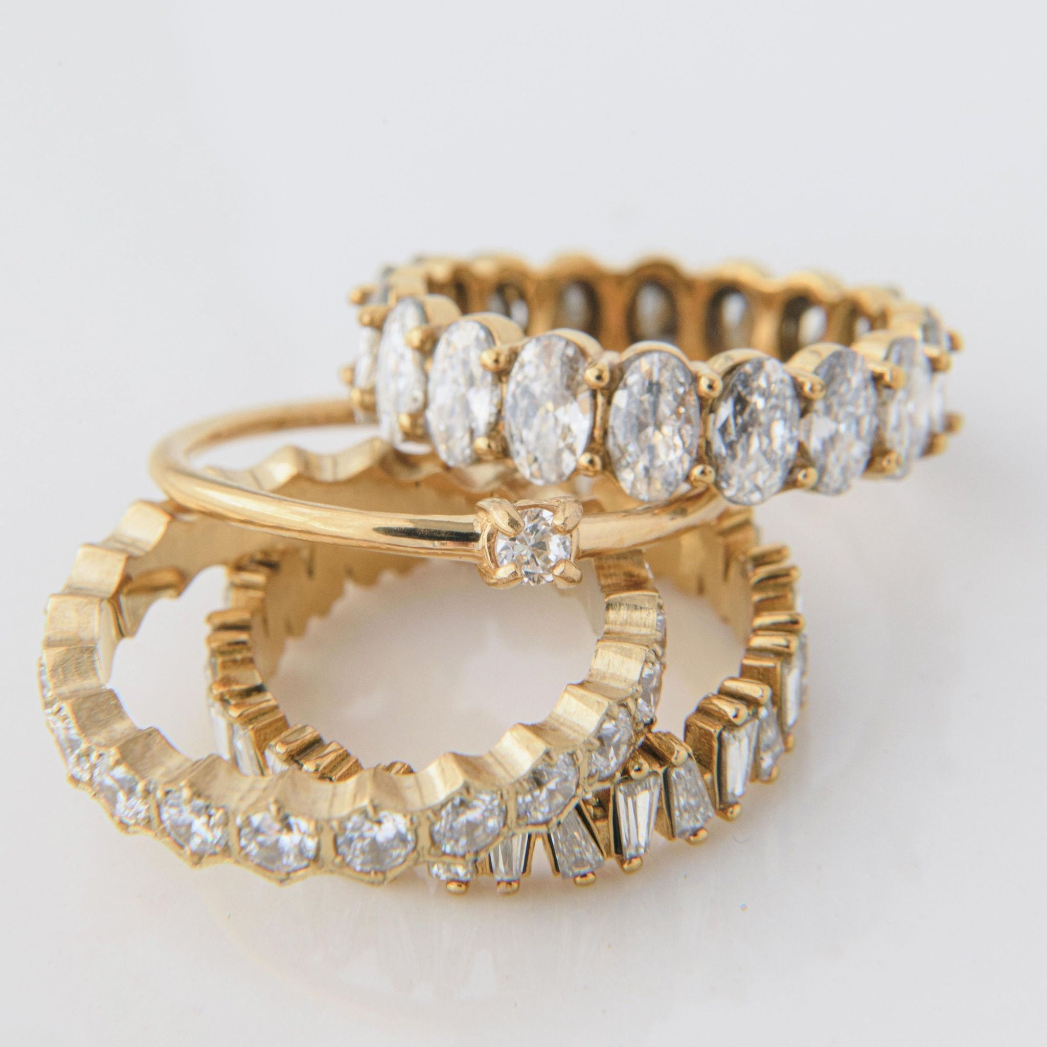 gold ring with single round Cubic Zirconia on a fine band