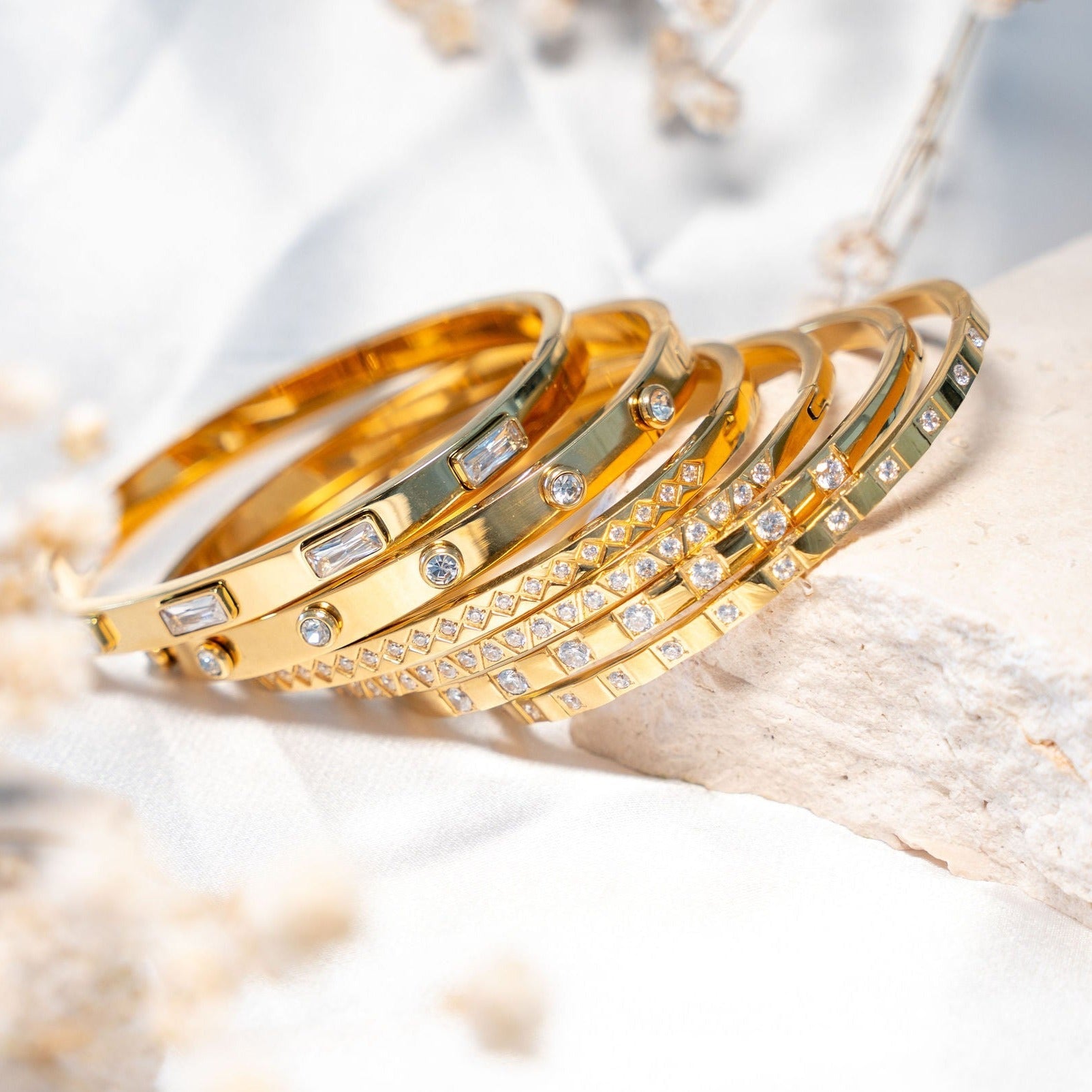 Waterproof gold bangle bracelet with baguette cubic zirconia stones