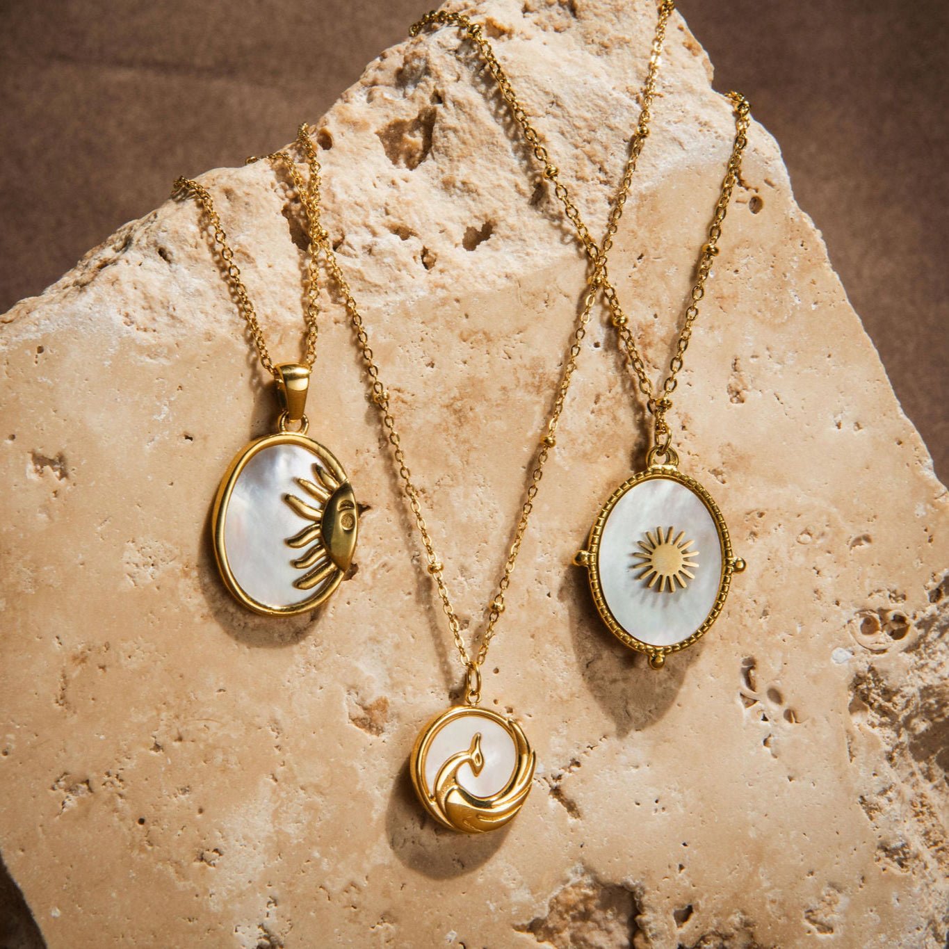Gold phoenix pendant necklace on waterproof beaded chain symbolising rebirth and strength