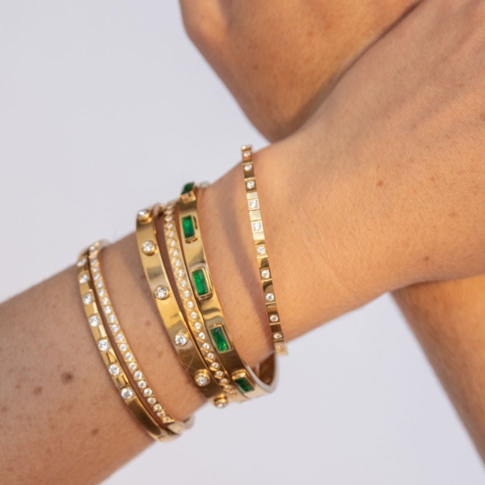 gold-plated bangle with diamond-cut pattern and cubic zirconia accents