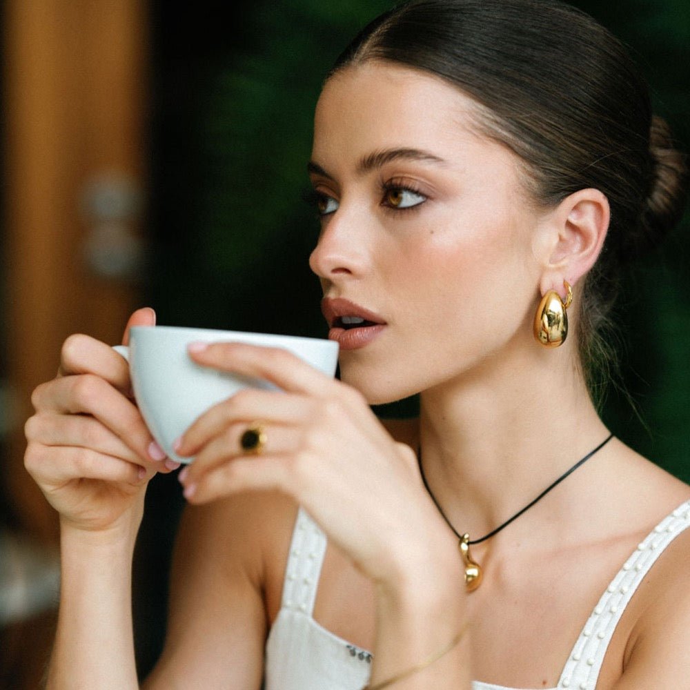 chunky gold stud earrings with sculptural teardrop shape