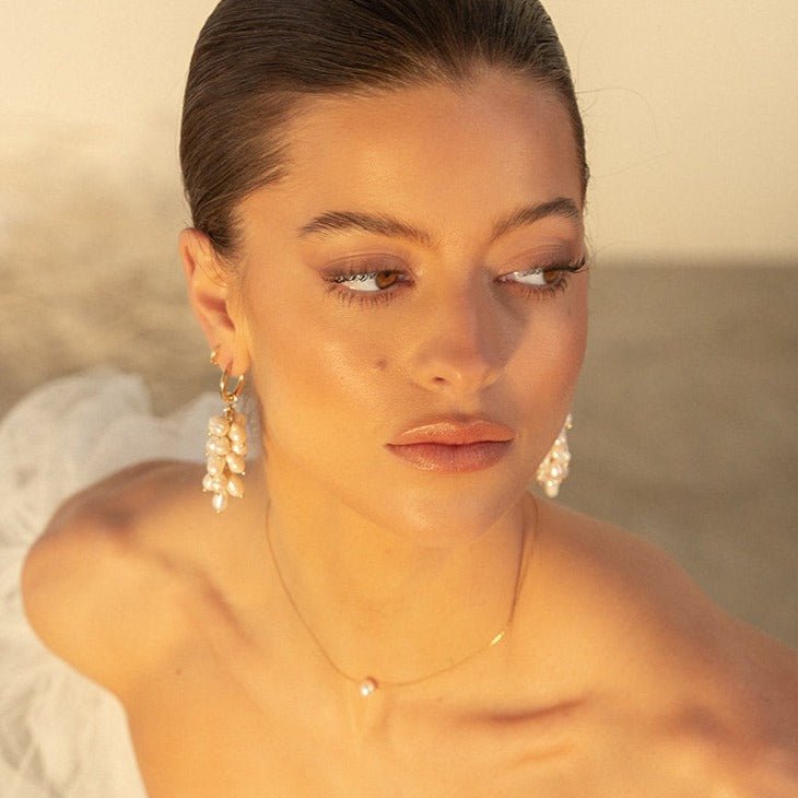 Gold necklace with single natural freshwater pearl on fine chain