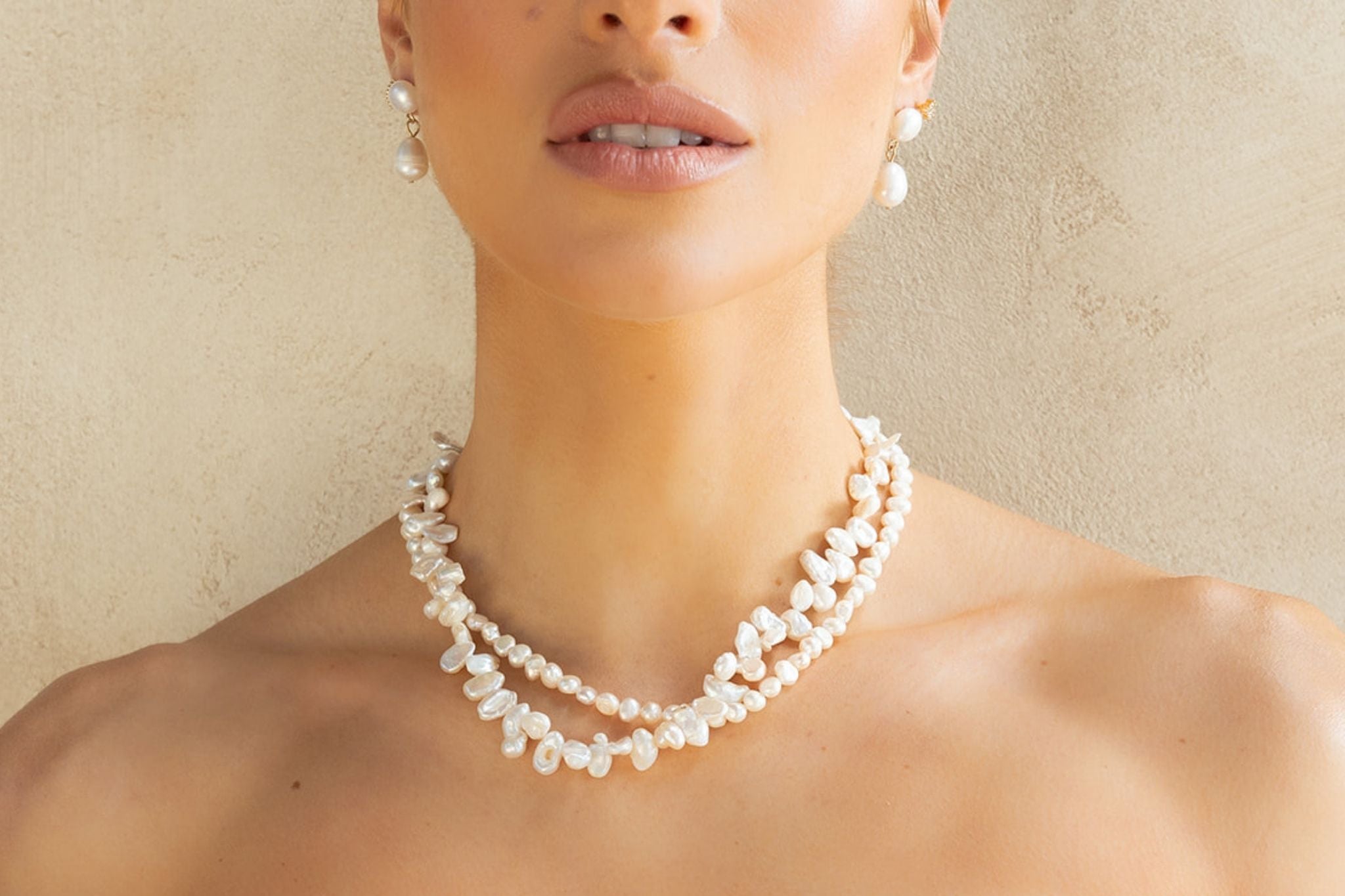 Explore timeless pearl jewellery including gold pearl earrings, freshwater pearl necklaces, bracelets and more. Elegant, modern, and made to last.