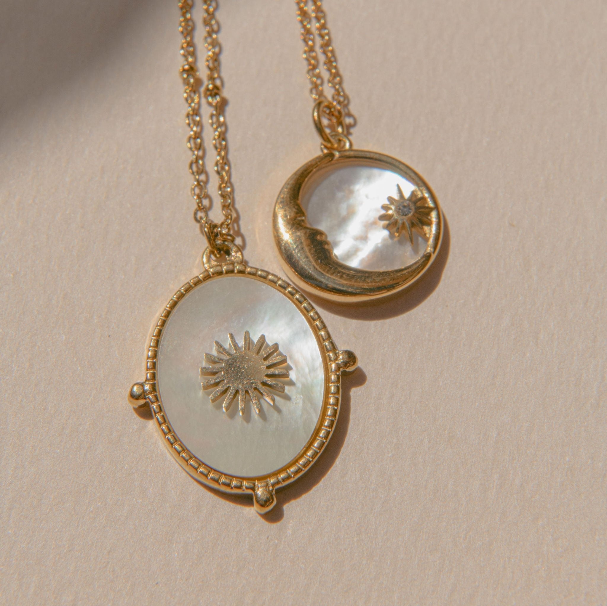 Gold sunburst pendant necklace with mother of pearl inlay and waterproof beaded frame