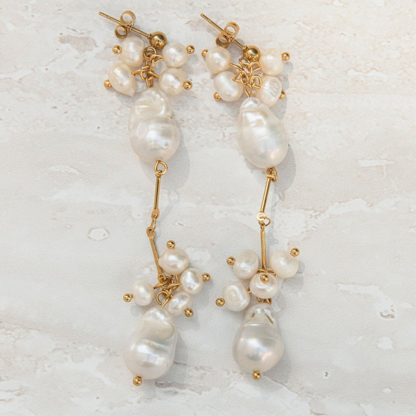 Gold pearl drop earrings with clustered freshwater pearls and waterproof gold stud setting for statement style