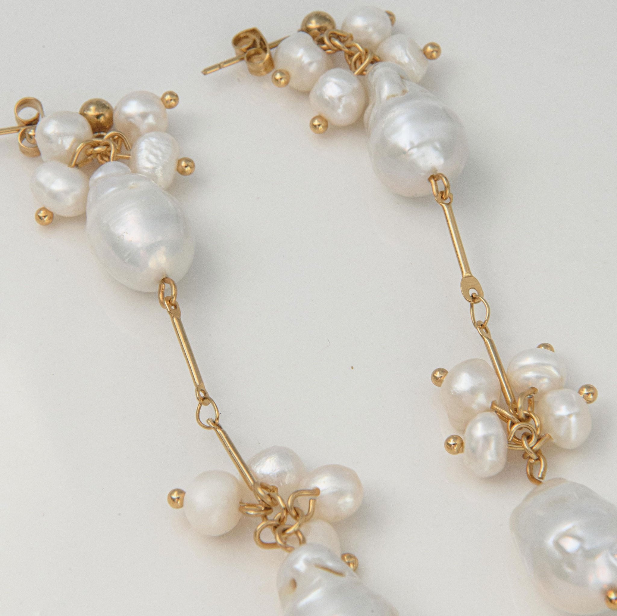 Gold pearl drop earrings with clustered freshwater pearls and waterproof gold stud setting for statement style