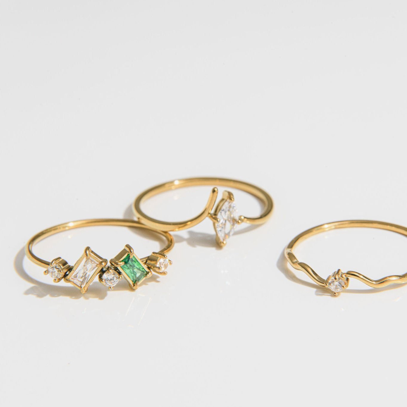 gold ring with open band and marquise-cut cubic zirconia