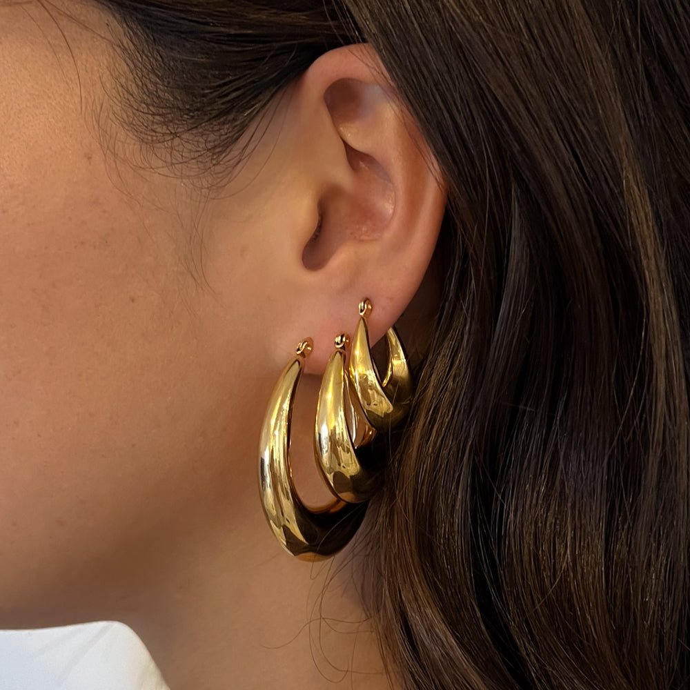 waterproof gold hoop earrings with sculptural teardrop design