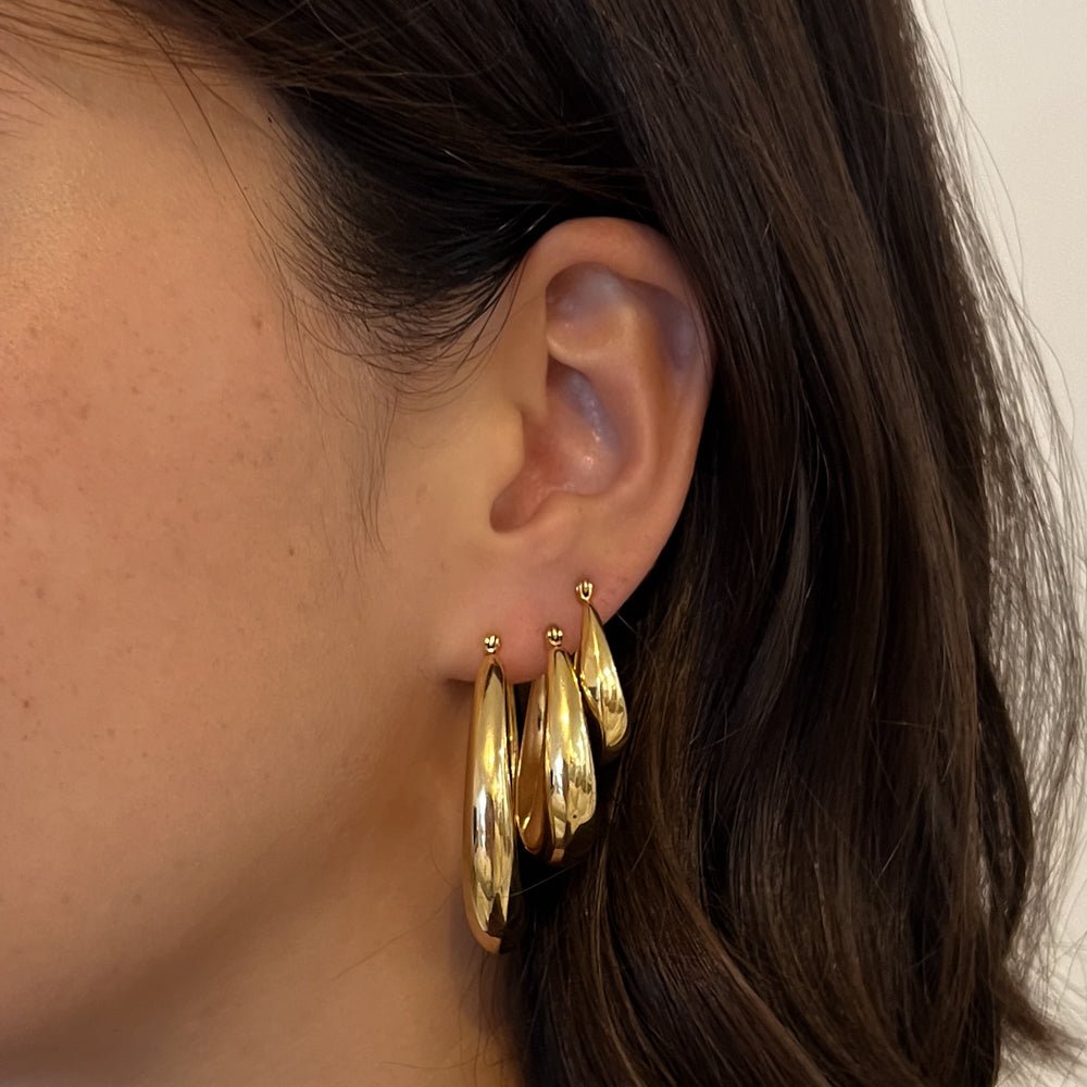 waterproof gold hoop earrings with sculptural teardrop design