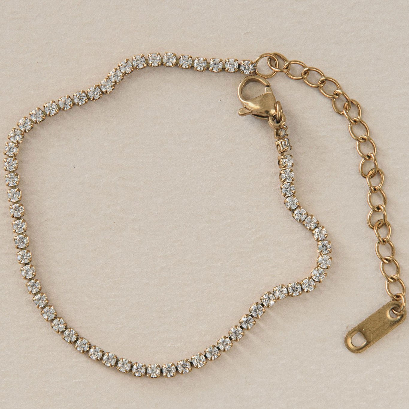 old tennis bracelet with round cubic zirconia stones and adjustable clasp