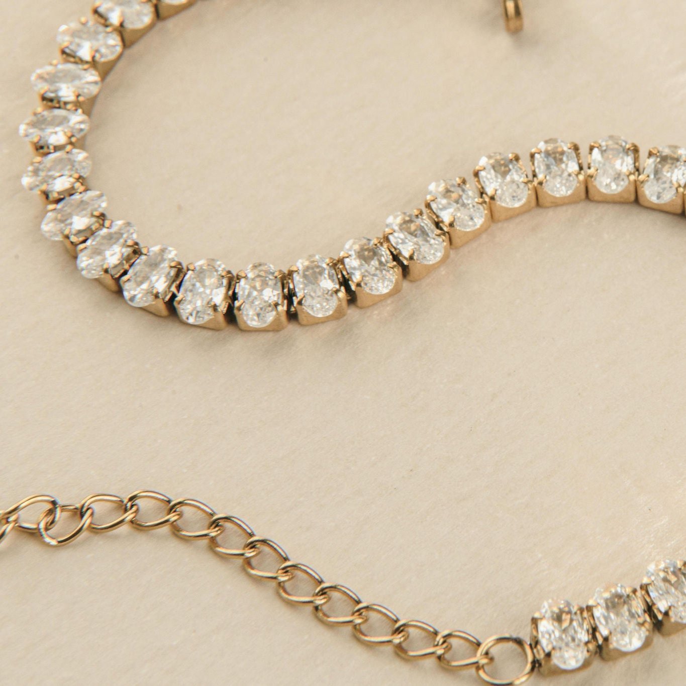 gold tennis bracelet with oval cubic zirconia stones for bridal or everyday wear