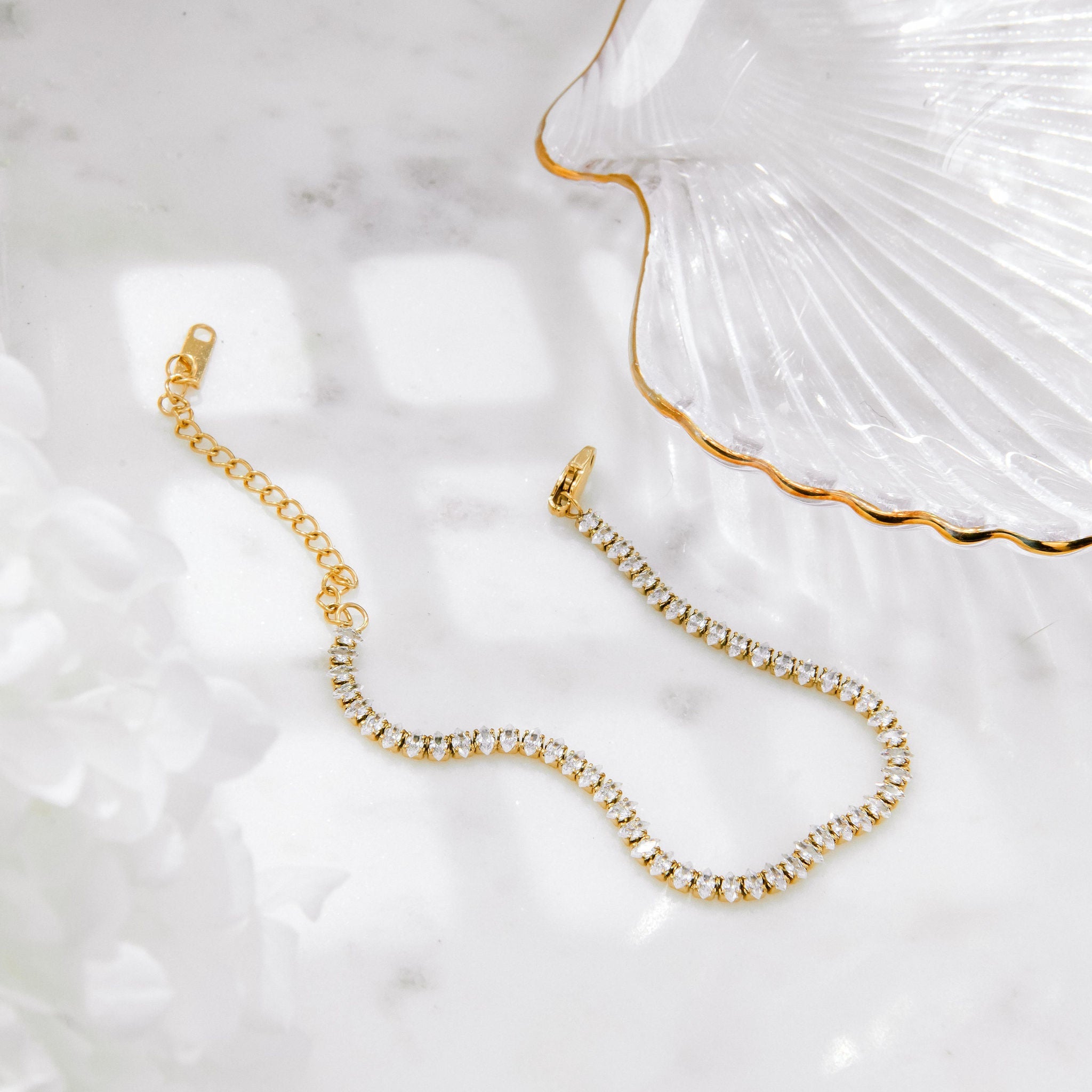 dainty gold tennis bracelet with marquise-cut Cubic Zirconia stones