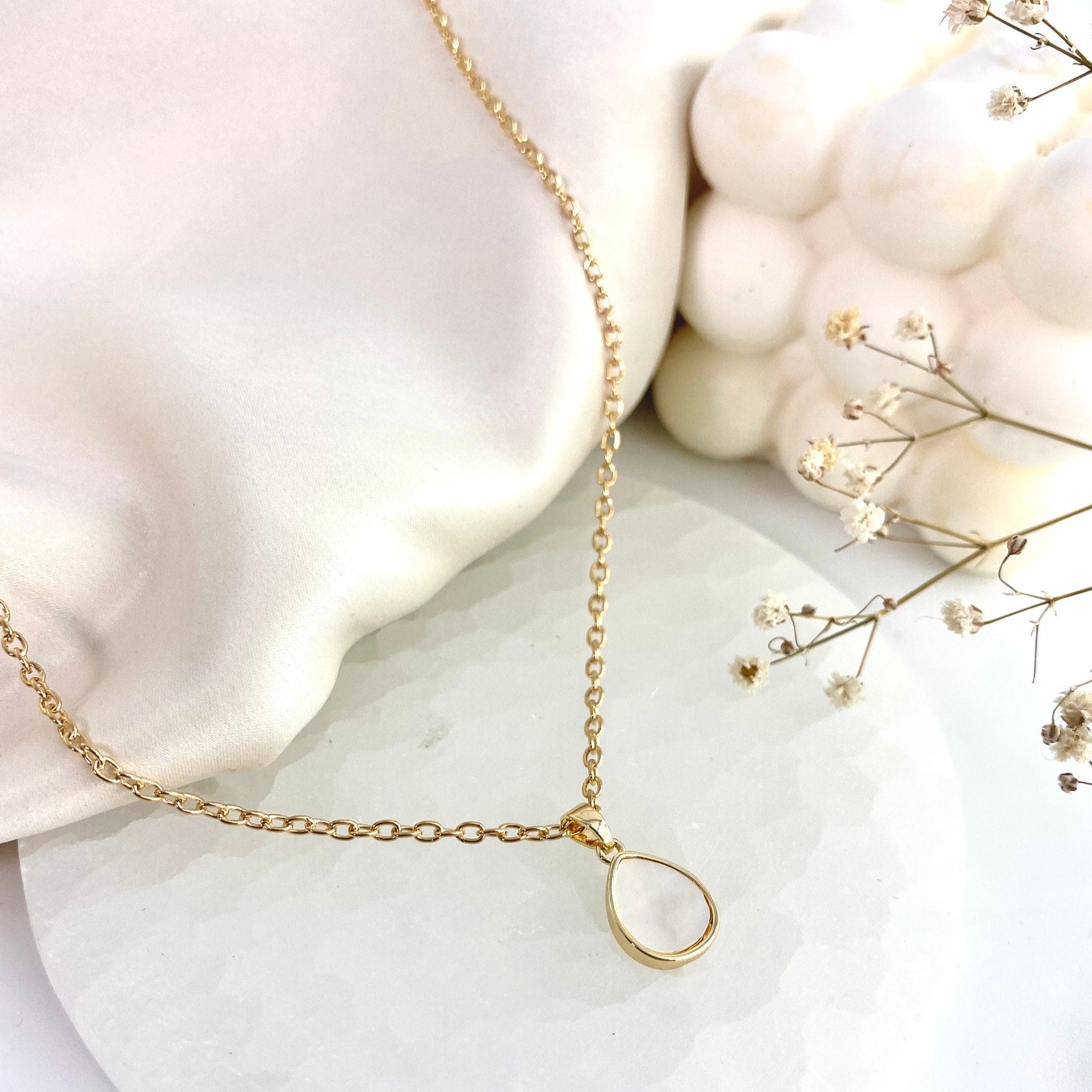 gold necklace with teardrop mother of pearl pendant