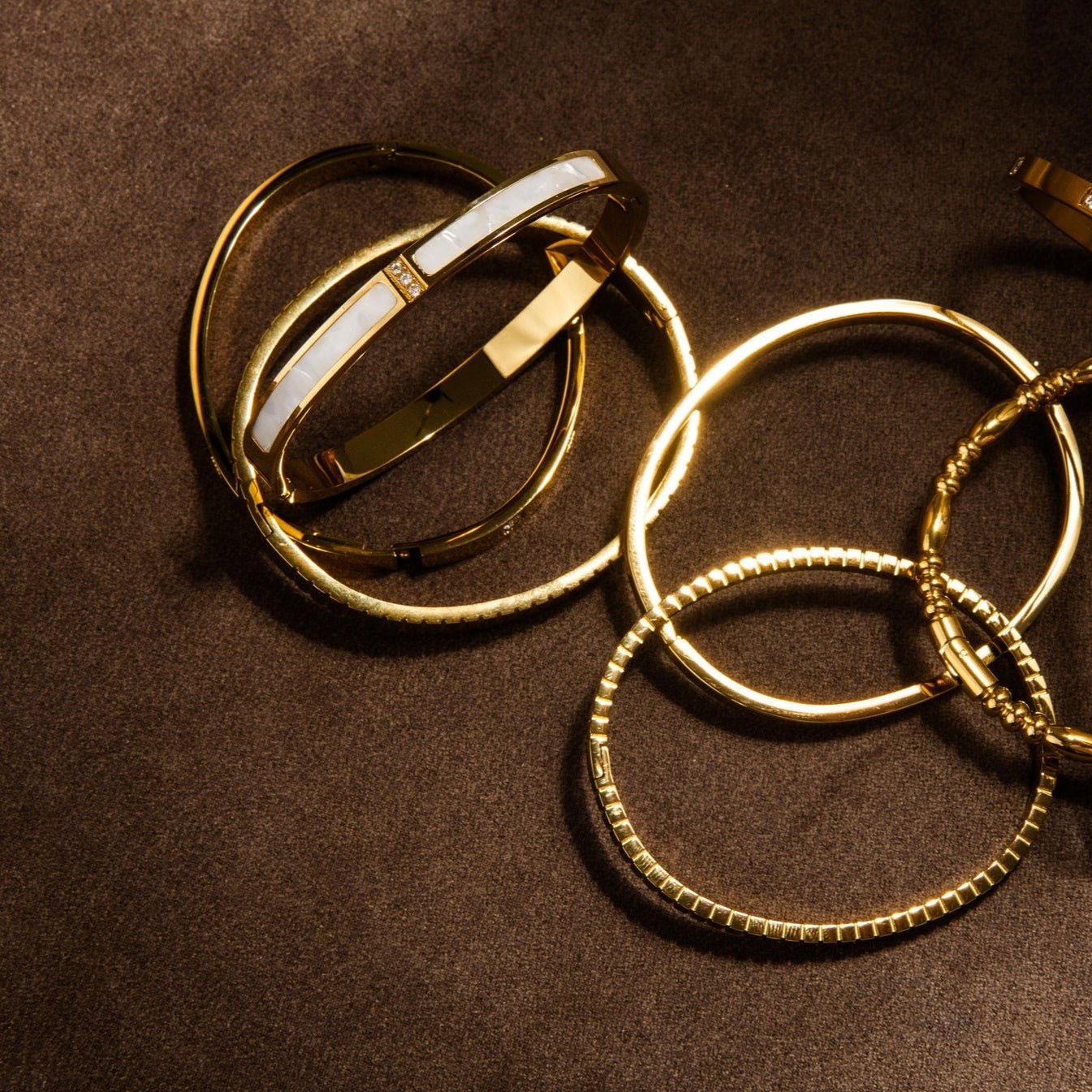 waterproof gold bangle with mother of pearl inlay and Cubic Zirconia