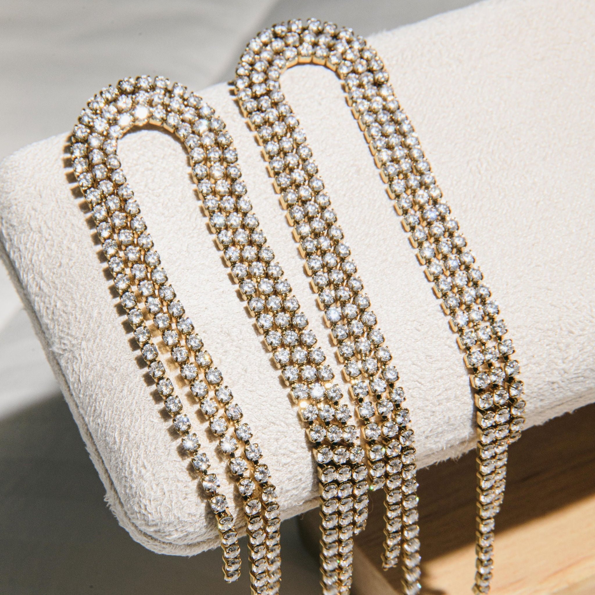 gold drop earrings with cascading cubic zirconia strands