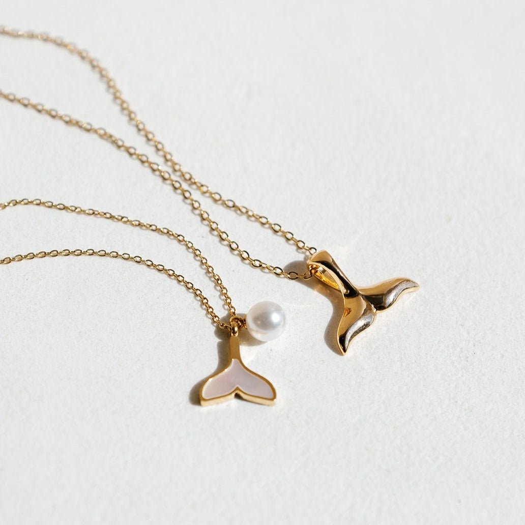 Gold whale tail necklace with mother of pearl inlay and freshwater pearl charm on waterproof chain