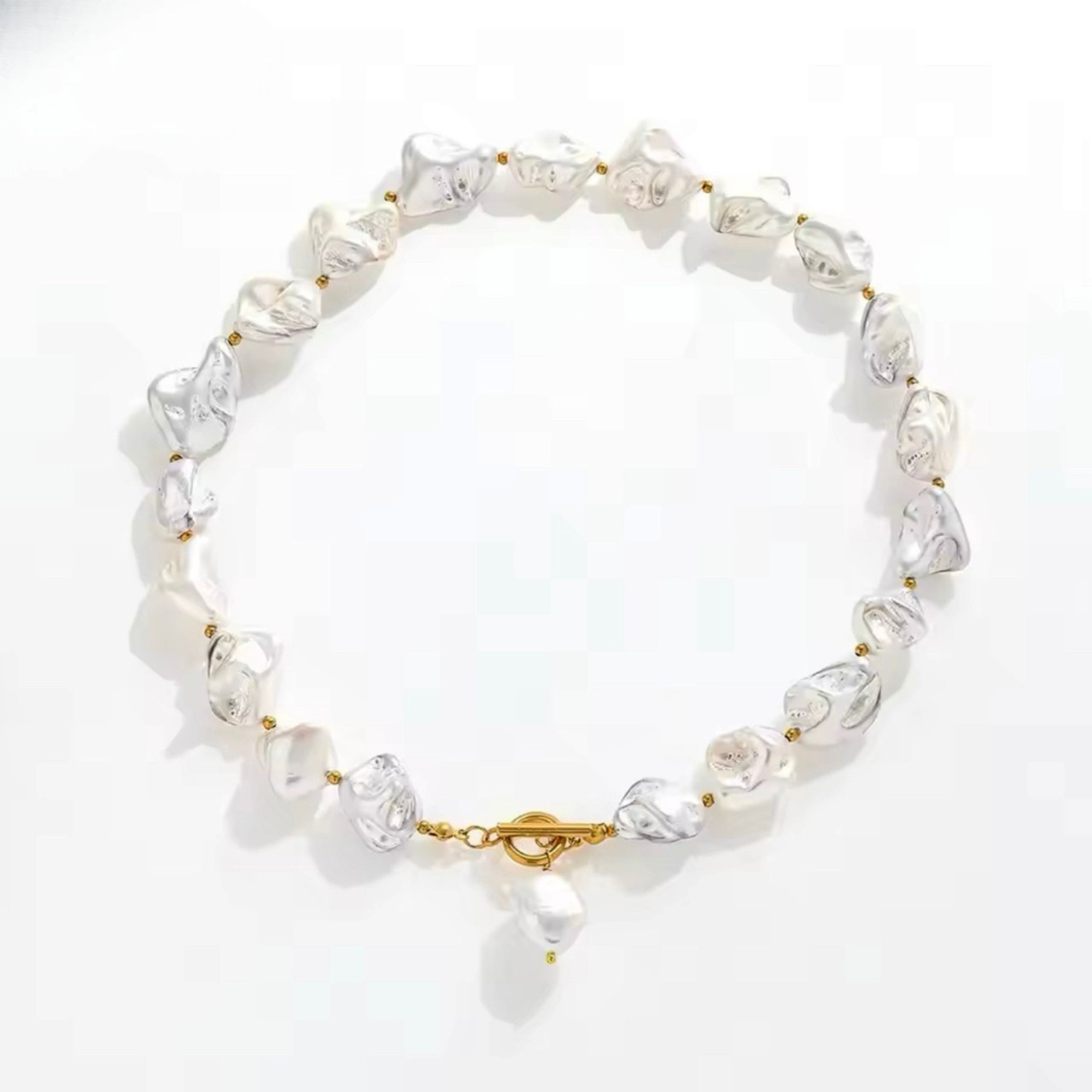 Chunky freshwater pearl necklace with waterproof gold clasp and organic statement design.