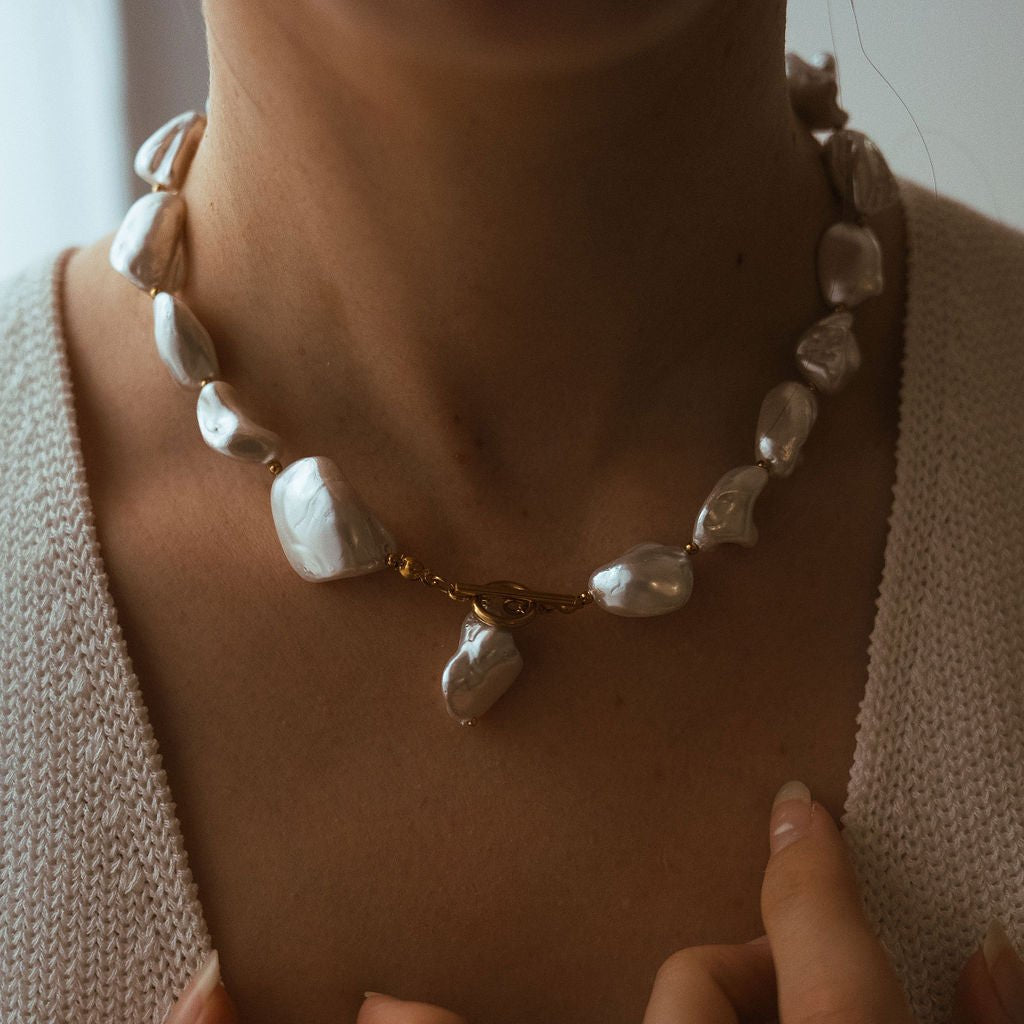 Chunky freshwater pearl necklace with waterproof gold clasp and organic statement design.