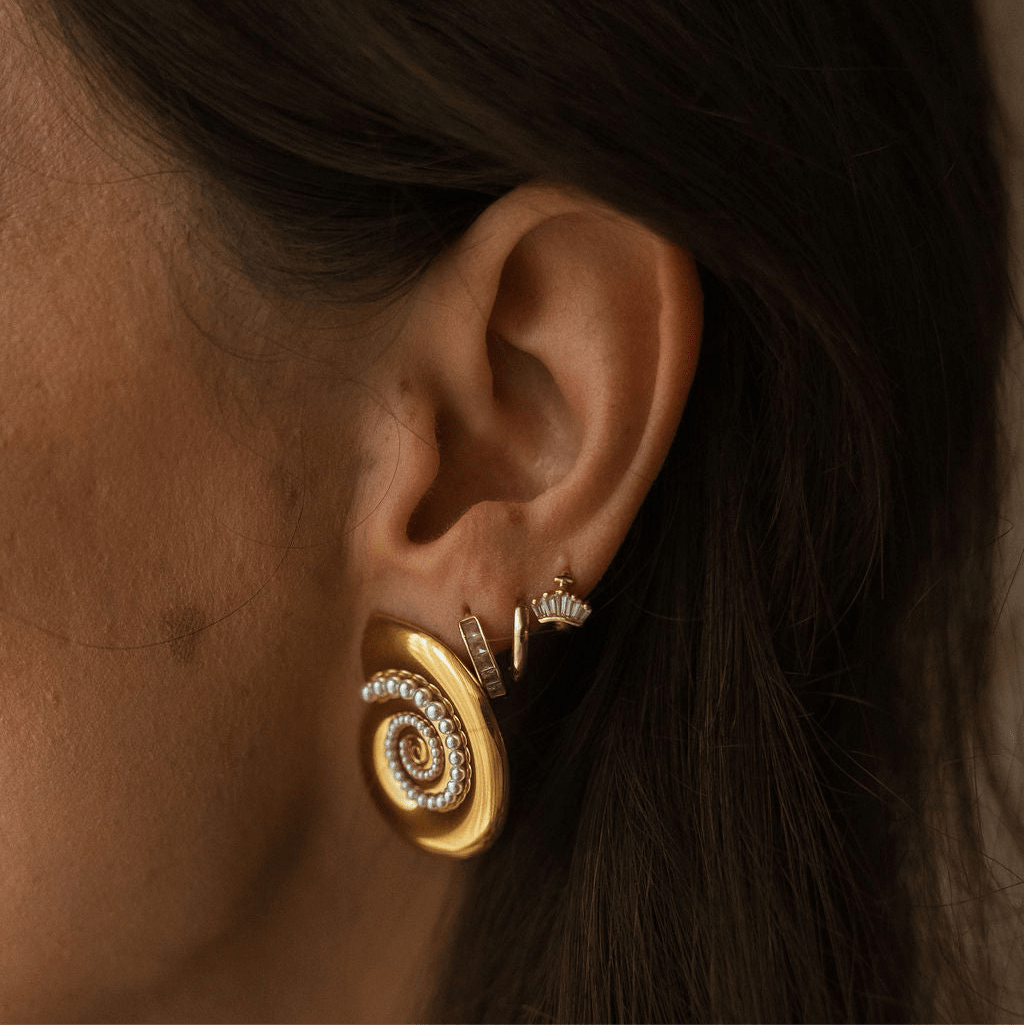 Paradiso Earrings with spiral gold shell design and pearl accents, gold statement earrings