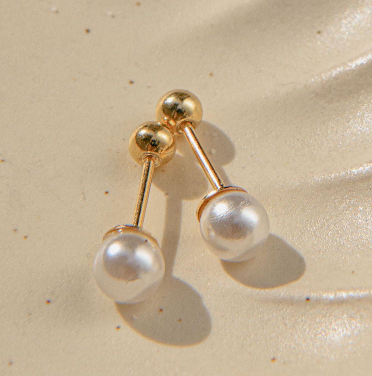 Gold pearl earrings with freshwater pearls and waterproof ballback stud design