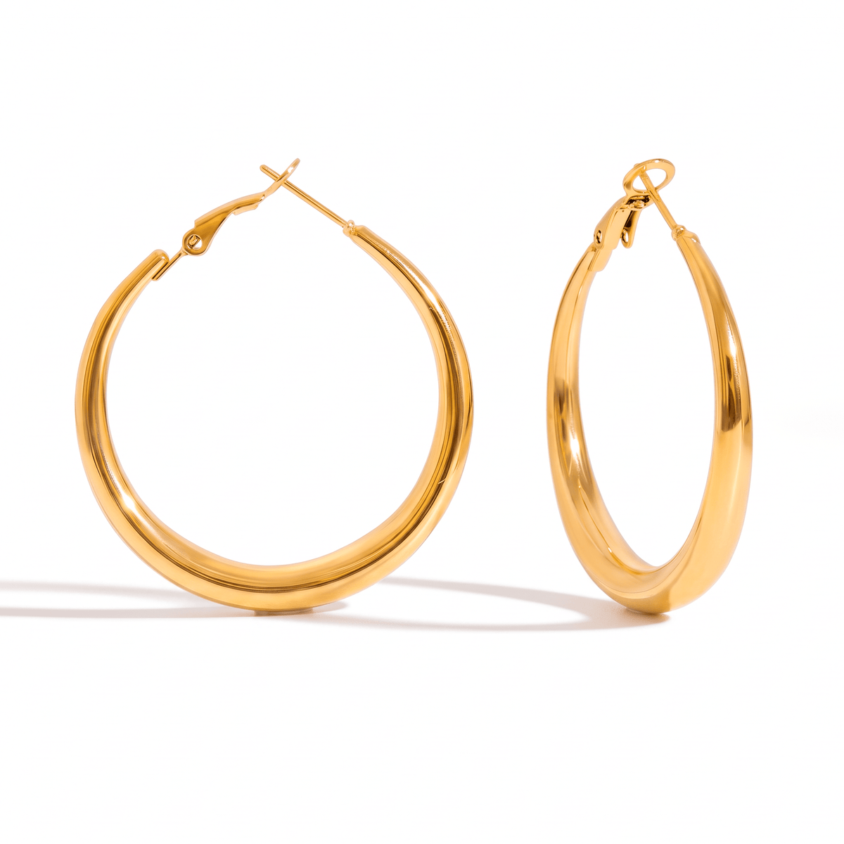 Sol polished gold hoop earrings with a rounded, tapered silhouette