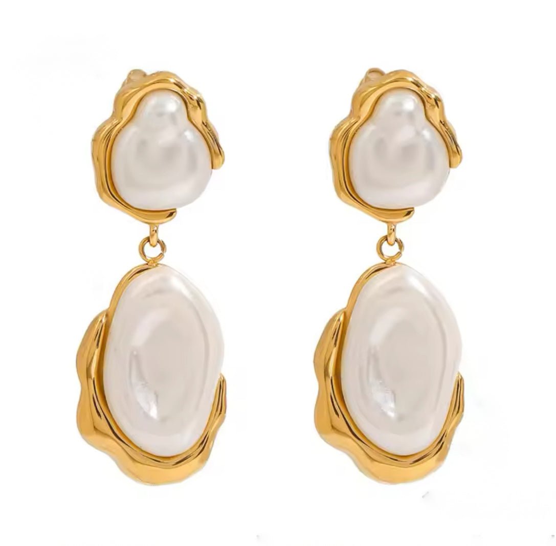 Solara pearl drop earrings featuring natural freshwater pearls framed in waterproof gold with an organic, sculptural design.